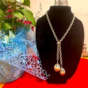 Gold tone torso with two pearls